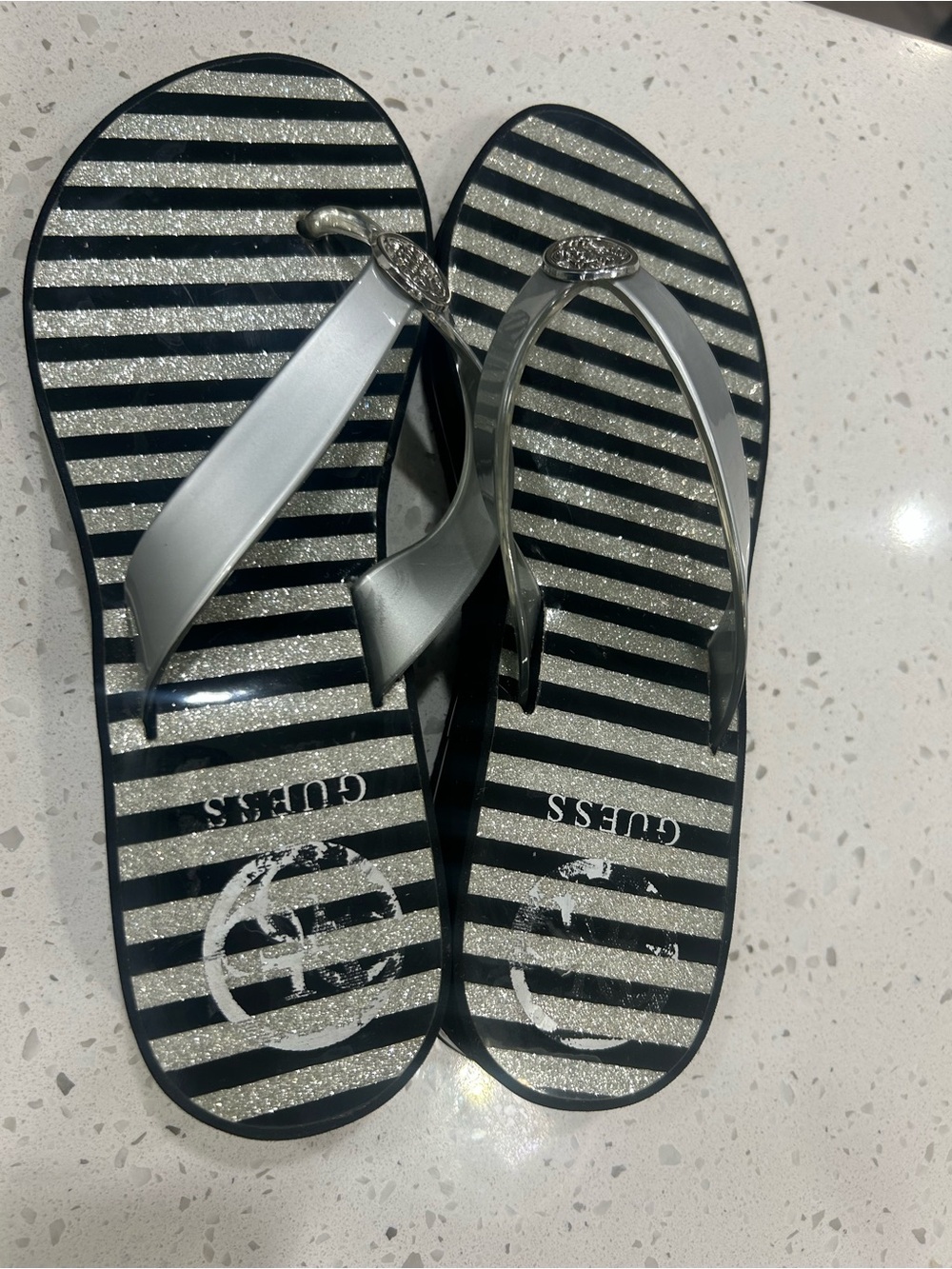 Guess women black & silver striped platform flip flops size 7